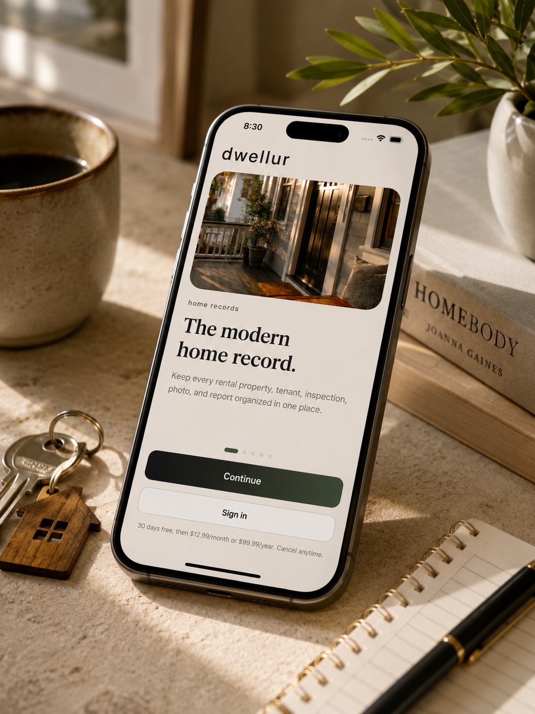 dwellur app displayed on an iPhone in a warm modern home setting